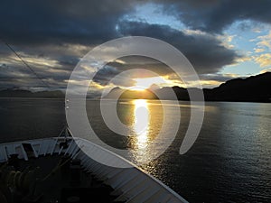 Cruising toward sunset at sea