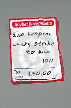Crumbled betting slip with path