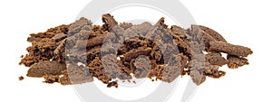 Crumbled Dutch cocoa cookies on a white background