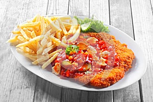 Crumbled Escalope with Sauce Paired with Fries