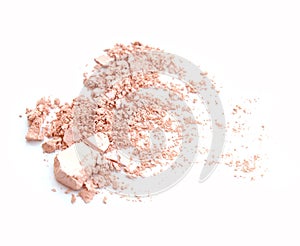 Crumbled natural powder make up on white background.