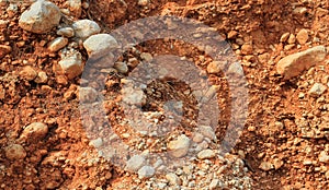Crumbled red stone rock wall