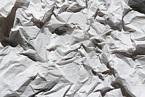 Crumbled white paper texture background. Creases and scratches. Old letter template. Craft paper for package and parcels.