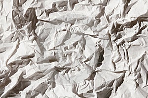 Crumbled white paper texture background. Creases and scratches. Old letter template. Craft paper for package and parcels.