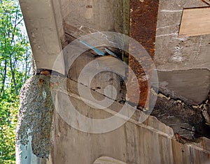 Crumbling infrastructure under a bridge photo