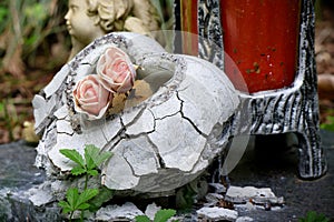crumbling stone heart at cemetery
