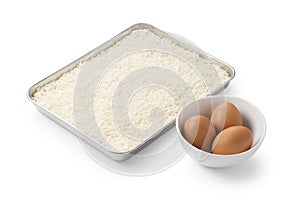 Crumbs and eggs on a white background