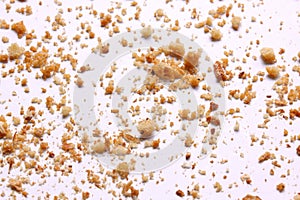 Crumbs on white background close-up view
