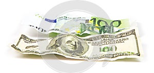 Crumpled banknotes of dollar vs euro
