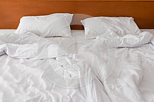 Crumpled bed white linen in the morning to the hotel