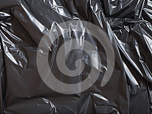 crumpled black plastic texture background