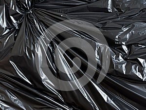 crumpled black plastic texture background