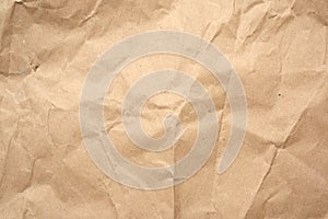 Crumpled blank sheet of brown wrapping kraft paper, vintage texture for the designer