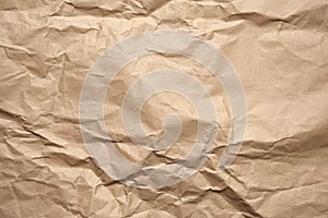 Crumpled blank sheet of brown wrapping kraft paper, vintage texture for the designer