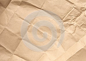 Crumpled blank sheet of brown wrapping kraft paper, vintage texture for the designer