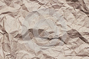 Crumpled brown craft paper background texture. Old paper sheet. Vintage letter template.