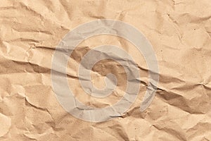 Crumpled brown paper texture. Kraft recycled paper background