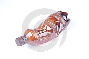 Crumpled Brown Plastic Bottle Isolated