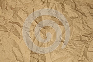 Crumpled brown recycled paper background. Copy space