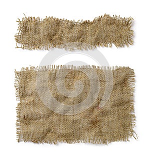 Crumpled burlap rectangular and oblong pieces isolated on white background. Natural color sackcloth patch with torn edges. Rough