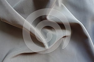 Crumpled dark grey viscose, cotton and polyester fabric