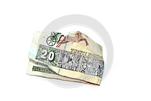 Crumpled Egyptian money of 20 LE twenty pounds isolated on white background, wrinkled 20 pounds cash bill banknote, Egypt money