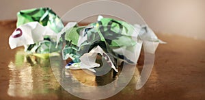 Crumpled 100 euro banknotes on golden background. Selective focus. Money value currency inflation concept