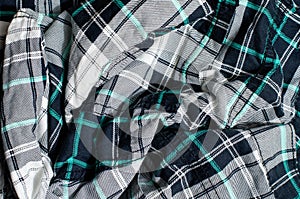 Crumpled fabric with Scottish tartan pattern.