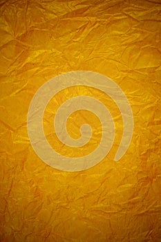 Crumpled gold paper recycling background