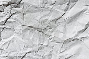 Crumpled gray craft paper texture background. Package wrapping. Old wrapping paper. Baking parchment. Letter template.