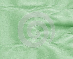 Crumpled green craft paper sheet