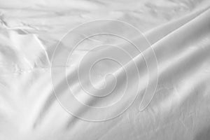 Crumpled messy white blanket untidy, Unmade bed sheet after waking up in the morning texture