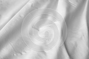 Crumpled messy white blanket untidy, Unmade bed sheet after waking up in the morning texture