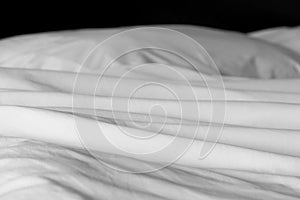 Crumpled messy white blanket untidy, Unmade bed sheet after waking up in the morning texture