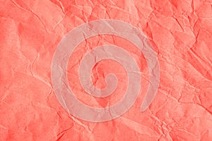 Crumpled orange-pink craft paper
