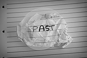 Crumpled paper ball with the word Past