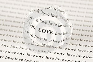 Crumpled paper ball with words Love