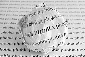 Crumpled paper ball with words Phobia photo
