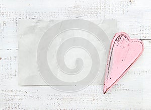 Crumpled paper heart on a white background