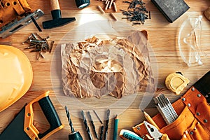 Crumpled paper mock up on woodwork desk
