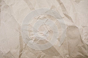 Crumpled paper texture for background. Rumpled kraft paper with copy space