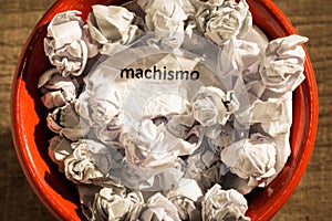 Crumpled paper written machismo, portuguese and spanish word for photo