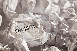 Paper written racism. Concept of old and abandoned idea or practice.