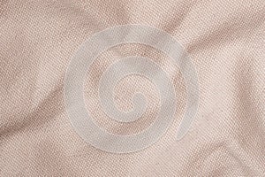 Crumpled pastel pink canvas texture, background of burlap, natural fabric
