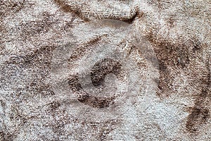 A crumpled piece of dirty, stained microfiber. Up close