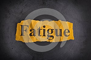 Crumpled piece of paper with the word Fatigue