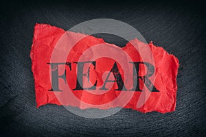 Crumpled piece of paper with the word Fear