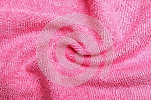 Crumpled pink microfiber cloth as background