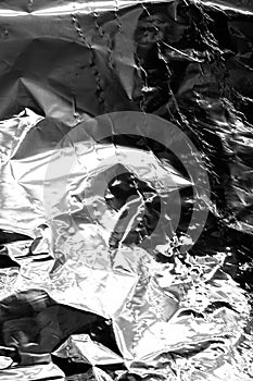 Crumpled sheet of aluminum shiny foil.