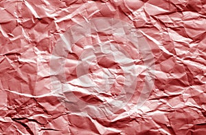 Crumpled sheet of paper with blur effect in red color